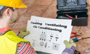 Repairman Is Looking At Documentation Of Hvac (heating, Ventilat