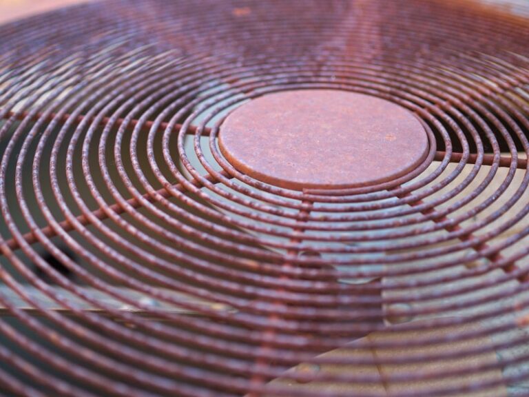 rusted grate of old outdoor AC unit 1