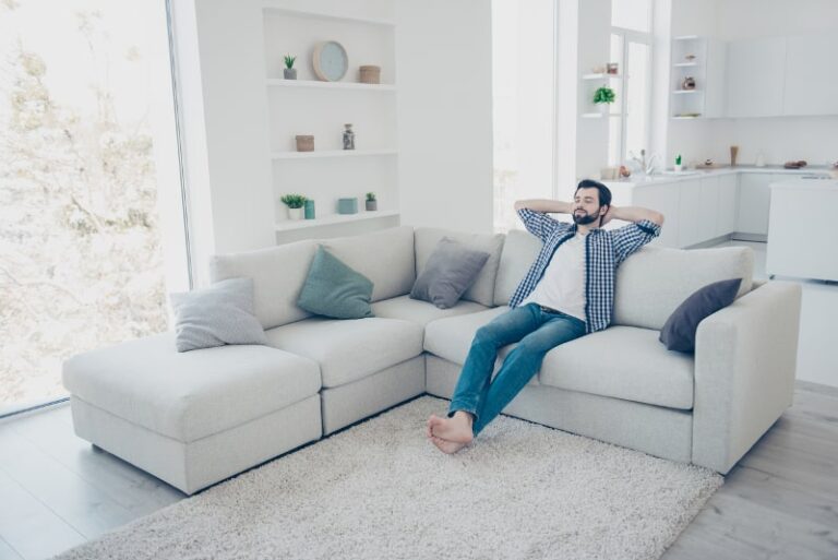 man relaxing on his couch