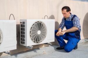 Man Works On HVAC installation