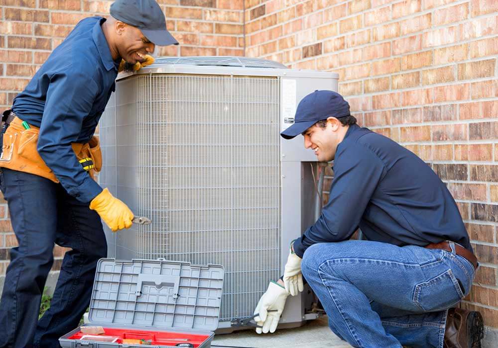hvac techs fixing ac