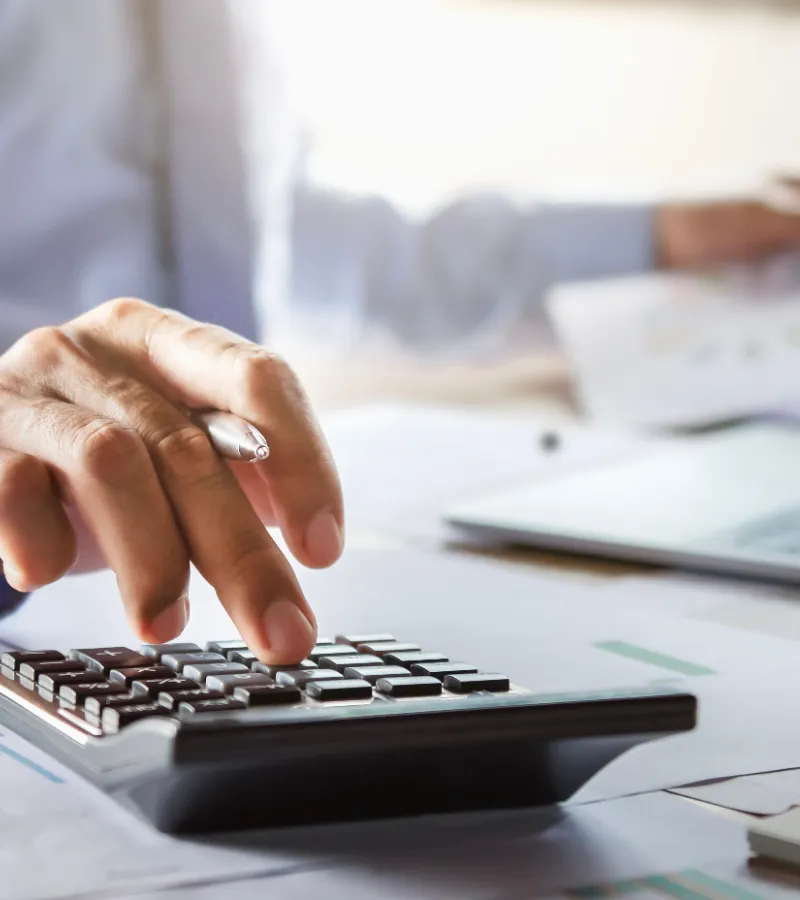 person using calculator to do finances